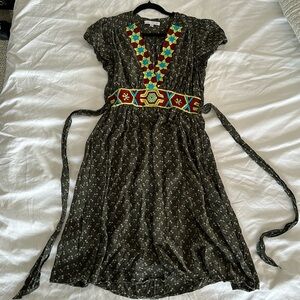 Anthropologie dress with embroidered waist and v neck.